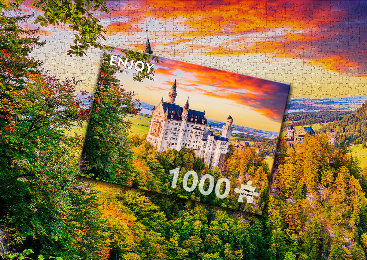 Neuschwanstein Castle in Autumn - assembled 1000-piece puzzle next to the ENJOY box